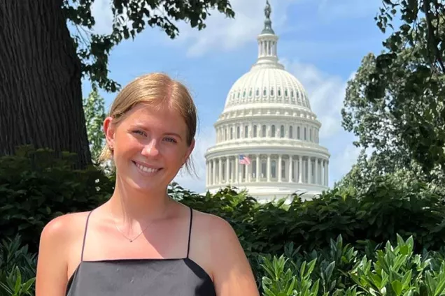 Student in front of the U.S. Capitol in Washington, D.C. Photo.