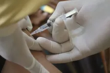 Hands in gloves giving injection 