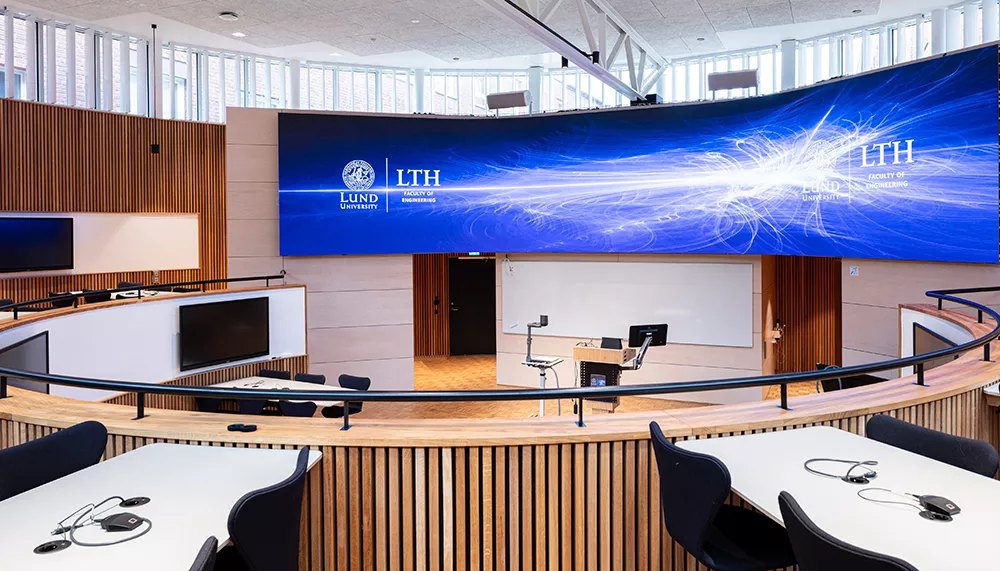 A circular room with a broad monitor at the Maskinhuset building.